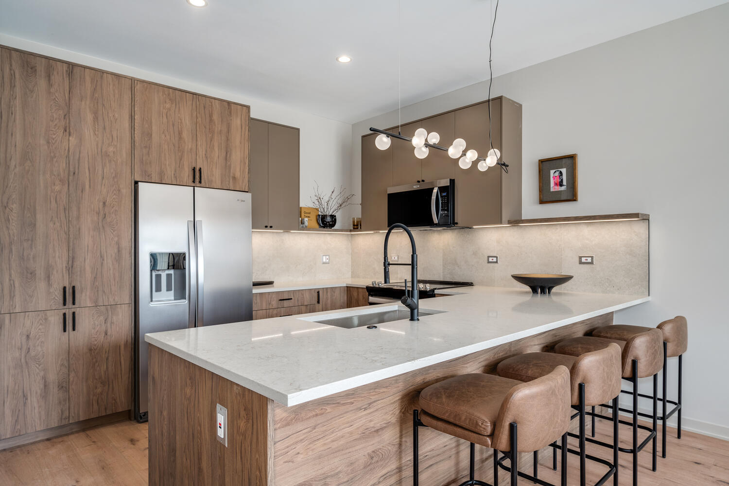Eat-in kitchen island with designer pendants